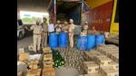 A joint team of IT City police and excise department on Wednesday arrested a truck driver and recovered 250 cartons of liquor which was authorised for sale only in Chandigarh. (HT Photo) A joint team of IT City police and excise department on Wednesday arrested a truck driver and recovered 250 cartons of liquor which was authorised for sale only in Chandigarh. (HT Photo)