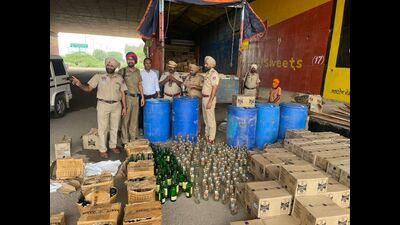 A joint team of IT City police and excise department on Wednesday arrested a truck driver and recovered 250 cartons of liquor which was authorised for sale only in Chandigarh. (HT Photo)