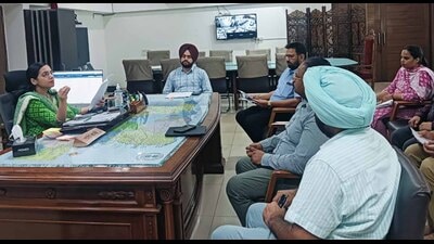 DC Sakshi Sawhney during a meeting with various department to reviews progress of work at School of Eminence Baddowal in Ludhiana on Wednesday. (HT Photo)
