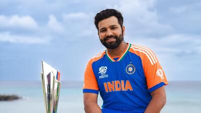 Rohit Sharma poses with the 2024 ICC Men's T20 World Cup trophy. (PTI) Rohit Sharma poses with the 2024 ICC Men's T20 World Cup trophy. (PTI)