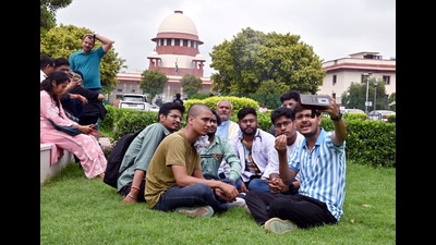 Students wait outside the Supreme Court during the hearing regarding alleged irregularities in NEET-UG 2024. (ANI) Students wait outside the Supreme Court during the hearing regarding alleged irregularities in NEET-UG 2024. (ANI)
