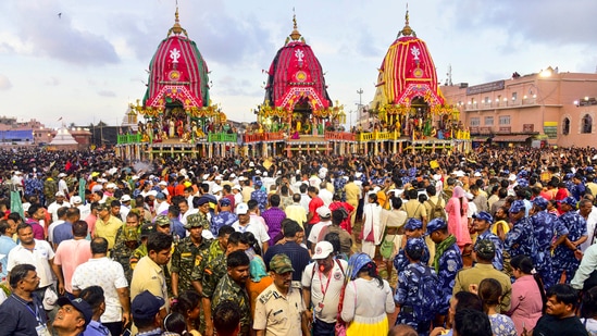 Puri: Devotees gather to witness the 'golden attire' ritual of Lords Jagannath, Balabhadra and Devi Subhadra, in Puri, Wednesday, July 17, 2024. (PTI Photo)(PTI)