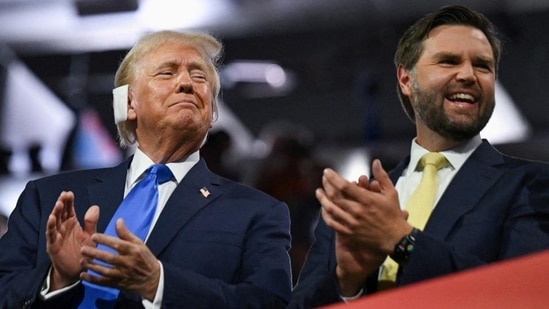 Republican presidential nominee and former US President Donald Trump (left) and Republican vice-presidential nominee JD Vance applaud on Day 2 of the Republican National Convention, in Milwaukee, Wisconsin, on Tuesday. (REUTERS)