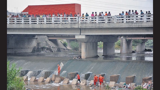 There is no trace of the 10-year-old boy who was washed away in a seasonal drain in Budhanpur village of Panchkula amid the downpour on Tuesday. (HT File)