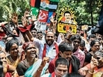 DMK supporters celebrate after the announcement of the results in Chennai on Tuesday. (AFP)(HT_PRINT) DMK supporters celebrate after the announcement of the results in Chennai on Tuesday. (AFP)(HT_PRINT)