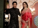 Former Indian cricketer Sachin Tendulkar and wife his Anjali Tendulkar pose for pictures on the red carpet as they attend the blessing ceremony of Anant Ambani and Radhika Merchant.