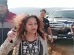 Screen grab from an undated video of IAS probationary officer Puja Khedkar's mother, Manorama, brandishing a small weapon. 