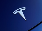 The front hood logo on a 2018 Tesla Model 3 electric vehicle is shown in this photo illustration taken in Cardiff, California, US (Reuters)