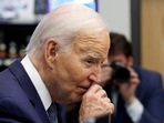 U.S. President Joe Biden rubs his nose while greeting shoppers inside Mario's Westside Market grocery store in Las Vegas, Nevada, U.S., July 16, 2024. REUTERS/Tom Brenner     TPX IMAGES OF THE DAY