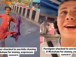 Snapshot of the girl running behind the tourist and asking for money. Snapshot of the girl running behind the tourist and asking for money.