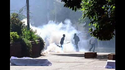 Bangladesh police personnel fire tear shells as students protest against quotas in government jobs. (AFP photo) Bangladesh police personnel fire tear shells as students protest against quotas in government jobs. (AFP photo)