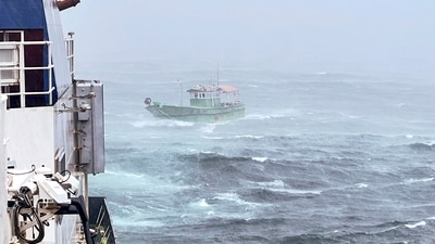 An Indian Fishing Boat (IFB) 'Aashni' after being rescued by personnel of Indian Coast Guard (ICG), with 11 crew onboard amid heavy rain (PTI Photo) (PTI) An Indian Fishing Boat (IFB) 'Aashni' after being rescued by personnel of Indian Coast Guard (ICG), with 11 crew onboard amid heavy rain (PTI Photo) (PTI)