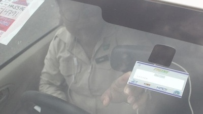 FASTag update: A man points to the FASTag on his vehicle's windshield, at the toll office at Kherki-Daula toll plaza, in Gurugram.