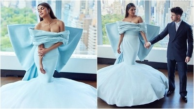 Priyanka turned into a modern-day Princess in this ice-blue gown featuring an off-shoulder draped neckline, a massive bow on the back, and a mermaid-style hem. (Instagram) Priyanka turned into a modern-day Princess in this ice-blue gown featuring an off-shoulder draped neckline, a massive bow on the back, and a mermaid-style hem. (Instagram)