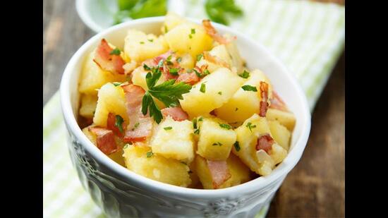 Toss diced and boiled potatoes with with sausages for a German-style salad. (ADOBE STOCK)