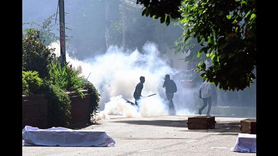 Bangladesh police personnel fire tear shells as students protest against quotas in government jobs. (AFP photo)