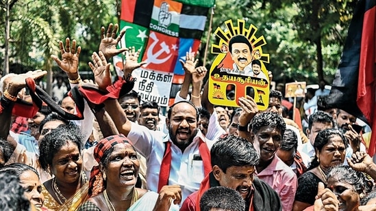 DMK supporters celebrate after the announcement of the results in Chennai on Tuesday. (AFP)(HT_PRINT) DMK supporters celebrate after the announcement of the results in Chennai on Tuesday. (AFP)(HT_PRINT)