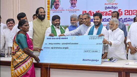 Hyderabad: Telangana Chief Minister A Revanth Reddy with senior leader K. Keshava Rao at the launch of farmers’ loan waiver scheme at the Secretariat, in Hyderabad on Thursday. (PTI)