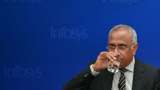 Salil Parekh, CEO and Managing Director of Infosys, drinks water while addressing a press conference held to announce the company's first quarter results in Bengaluru.(AFP)