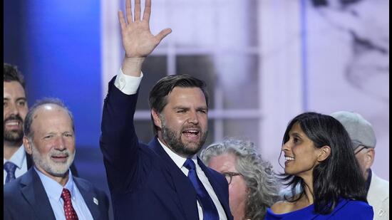 Republican vice-presidential candidate Sen JD Vance and his wife Usha Chilukuri Vance, right, are joined on stage by members of their family during the Republican National Convention in Milwaukee, on Wednesday. (AP)