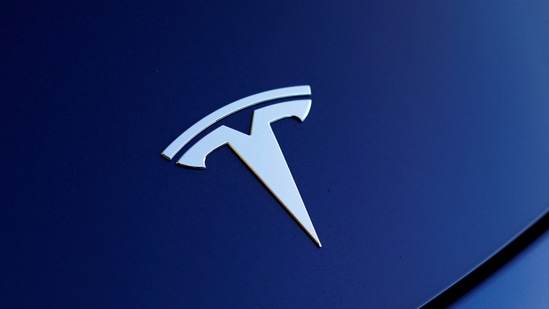 The front hood logo on a 2018 Tesla Model 3 electric vehicle is shown in this photo illustration taken in Cardiff, California, US (Reuters)