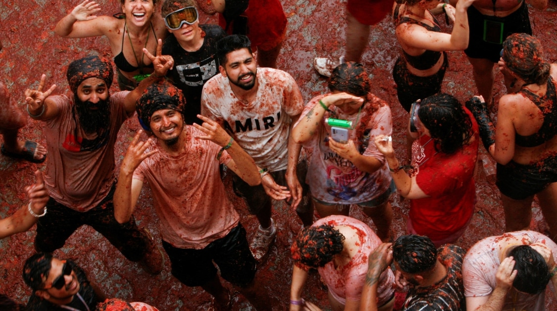 This tomato-throwing festival can be messy but extremely fun. (Google Image )