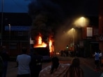 A bus burns during unrest in Harehills, Leeds, Britain, July 18, 2024 in this picture obtained from social media.  “@robin_singh” on Instagram