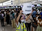 Hong Kong Express Airways passengers queue at counters in Hong Kong International Airport amid system outages disrupting the airline's operations, in Hong Kong.