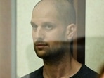 US journalist Evan Gershkovich, accused of espionage, stands inside a glass defendants' cage during the verdict announcement at the Sverdlovsk Regional Court in Yekaterinburg on July 19, 2024. (Photo by Alexander NEMENOV / AFP)(AFP) US journalist Evan Gershkovich, accused of espionage, stands inside a glass defendants' cage during the verdict announcement at the Sverdlovsk Regional Court in Yekaterinburg on July 19, 2024. (Photo by Alexander NEMENOV / AFP)(AFP)