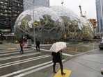 The Amazon Spheres, a few steps away from the office tower where Jeff Bezos leads the retail behemoth is part of the company’s urban campus of unmarked office buildings where more than 40,000 people report to work. (Ted S. Warren/AP) The Amazon Spheres, a few steps away from the office tower where Jeff Bezos leads the retail behemoth is part of the company’s urban campus of unmarked office buildings where more than 40,000 people report to work. (Ted S. Warren/AP)