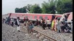 The body was spotted by railways officials when cranes lifted a wagon of the train at the site of the mishap. (HT photo) The body was spotted by railways officials when cranes lifted a wagon of the train at the site of the mishap. (HT photo)