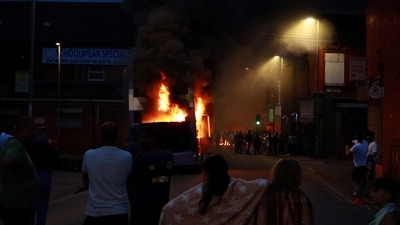 A bus burns during unrest in Harehills, Leeds, Britain, July 18, 2024 in this picture obtained from social media.  “@robin_singh” on Instagram (“@robin_singh” via REUTERS)