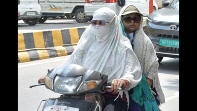 Commuters braving heat and humidity in Prayagraj. (HT Photo)