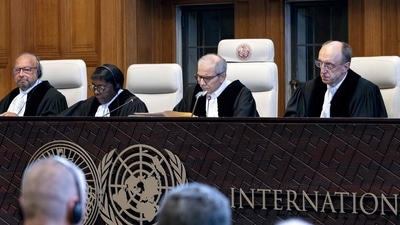 Judge and President of the International Court of Justice (ICJ), Nawaf Salam (2nd R) delivers a non-binding ruling on the legal consequences of the Israeli occupation of the West Bank and East Jerusalem at the International Court of Justice (ICJ) in The Hague on July 19, 2024. (AFP) Judge and President of the International Court of Justice (ICJ), Nawaf Salam (2nd R) delivers a non-binding ruling on the legal consequences of the Israeli occupation of the West Bank and East Jerusalem at the International Court of Justice (ICJ) in The Hague on July 19, 2024. (AFP)
