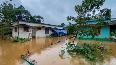 A flooded locality of Thalappuzha following a heavy downpour, in Wayanad on July 18. (PTI) A flooded locality of Thalappuzha following a heavy downpour, in Wayanad on July 18. (PTI)