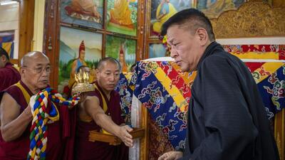 Penpa Tsering, President of Central Tibetan Administration, right, pays his respects in front of a ceremonial chair of Tibetan spiritual leader the Dalai Lama at an event. (AP FILE) Penpa Tsering, President of Central Tibetan Administration, right, pays his respects in front of a ceremonial chair of Tibetan spiritual leader the Dalai Lama at an event. (AP FILE)