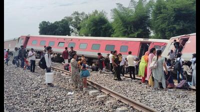 The body was spotted by railways officials when cranes lifted a wagon of the train at the site of the mishap. (HT photo)