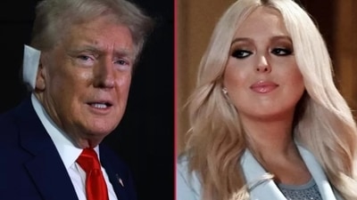 Tiffany Trump, who was still beaming, reached over to touch Donald Trump's chest and seemed to be trying to give him a side kiss. However, she failed in her attempt and kissed the air instead. (GETTY IMAGES/AFP ) Tiffany Trump, who was still beaming, reached over to touch Donald Trump's chest and seemed to be trying to give him a side kiss. However, she failed in her attempt and kissed the air instead. (GETTY IMAGES/AFP )