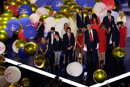 Former U.S. President Donald Trump onstage with his family as balloons fall following his speech on Day 4 of the Republican National Convention (RNC), at the Fiserv Forum in Milwaukee, Wisconsin, U.S., July 18, 2024. (REUTERS)