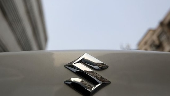 The logo of Maruti Suzuki India Limited is pictured on a car parked outside a showroom in New Delhi, India.