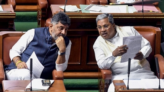 Karnataka chief minister Siddaramaiah with state deputy chief minister DK Shivakumar attend the proceedings on the first day of monsoon session of state assembly, in Bengaluru on Monday. (ANI)(HT_PRINT)
