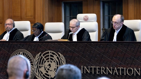 Judge and President of the International Court of Justice (ICJ), Nawaf Salam (2nd R) delivers a non-binding ruling on the legal consequences of the Israeli occupation of the West Bank and East Jerusalem at the International Court of Justice (ICJ) in The Hague on July 19, 2024.(AFP)