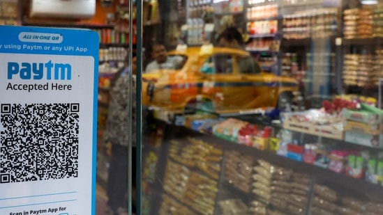 Paytm Q1 results: A QR code sticker of the digital payment app Paytm is seen outside a grocery store in Kolkata, India.(Reuters)