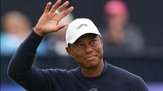 Tiger Woods acknowledges the crowd at the 18th green after finishing his second round at The 152nd Open Championship. (REUTERS)