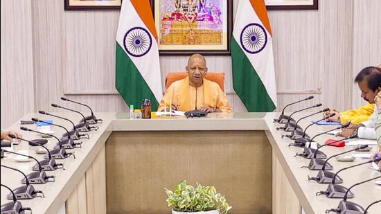 Uttar Pradesh chief minister Yogi Adityanath chairs a meeting with state cabinet ministers on July 17. (PTI)