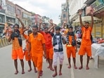 Varanasi, Jul 19 (ANI): Kanwariyas (Shiva devotees) carrying metal pots filled with water from the River Ganga during their annual Kanwar Yatra, in Varanasi on Friday. (ANI Photo)(Rajesh Journalist) Varanasi, Jul 19 (ANI): Kanwariyas (Shiva devotees) carrying metal pots filled with water from the River Ganga during their annual Kanwar Yatra, in Varanasi on Friday. (ANI Photo)(Rajesh Journalist)