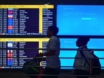 Passengers seen waiting after a major disruption in Microsoft Corp.'s cloud services caused widespread flight cancellations and delays. (Hindustan Times)