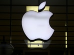 The Apple logo is illuminated at a store in the city center in Munich, Germany. The Apple logo is illuminated at a store in the city center in Munich, Germany.