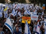 Israelis waving their national flag gather during an anti-government rally calling for early elections, outside the Knesset or Israeli Parliament in Jerusalem on June 18, 2024, amid the ongoing conflict in the Gaza Strip between Israel and the Palestinian militant Hamas movement. (Photo by Menahem KAHANA / AFP)(AFP) Israelis waving their national flag gather during an anti-government rally calling for early elections, outside the Knesset or Israeli Parliament in Jerusalem on June 18, 2024, amid the ongoing conflict in the Gaza Strip between Israel and the Palestinian militant Hamas movement. (Photo by Menahem KAHANA / AFP)(AFP)