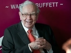 Warren Buffett, chairman and CEO of Berkshire Hathaway, smiles as he plays bridge following the annual Berkshire Hathaway shareholders meeting in Omaha.